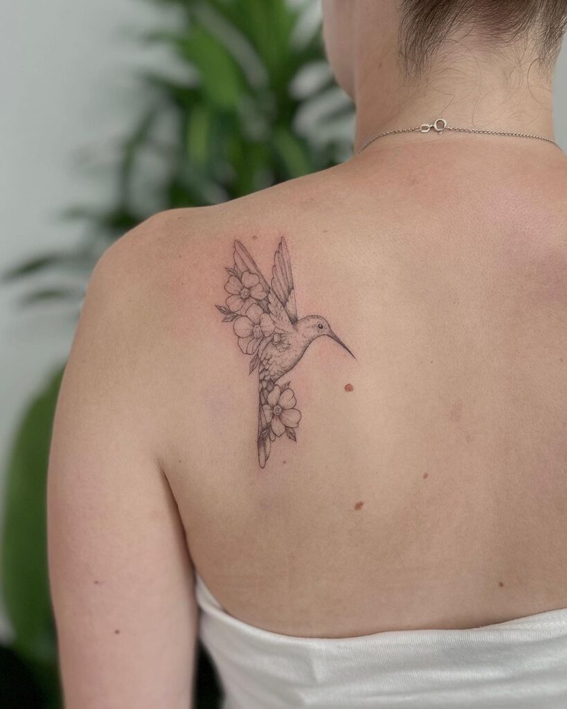 A hummingbird tattoo on the back