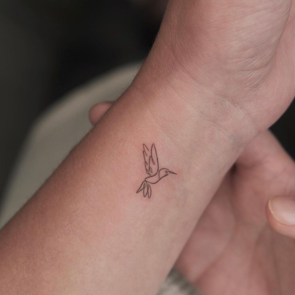 A linework hummingbird tattoo