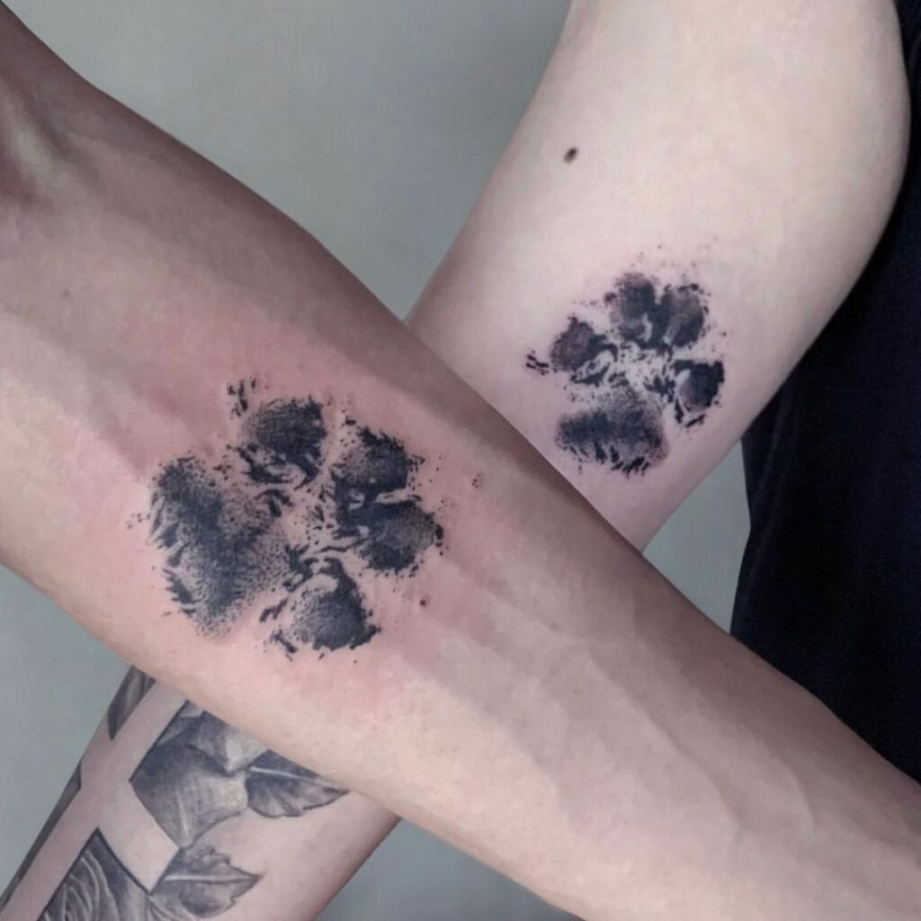 A matching paw print tattoo 