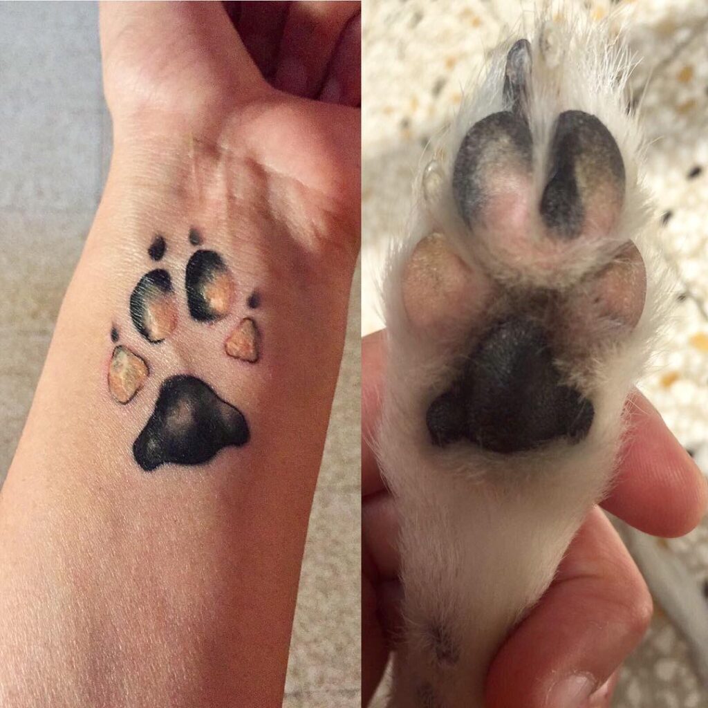 A paw print tattoo on the wrist 