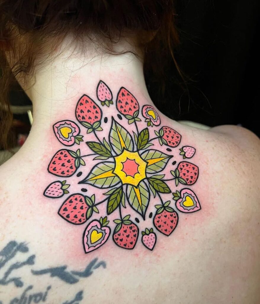 A real piece of art- strawberry tattoo on neck