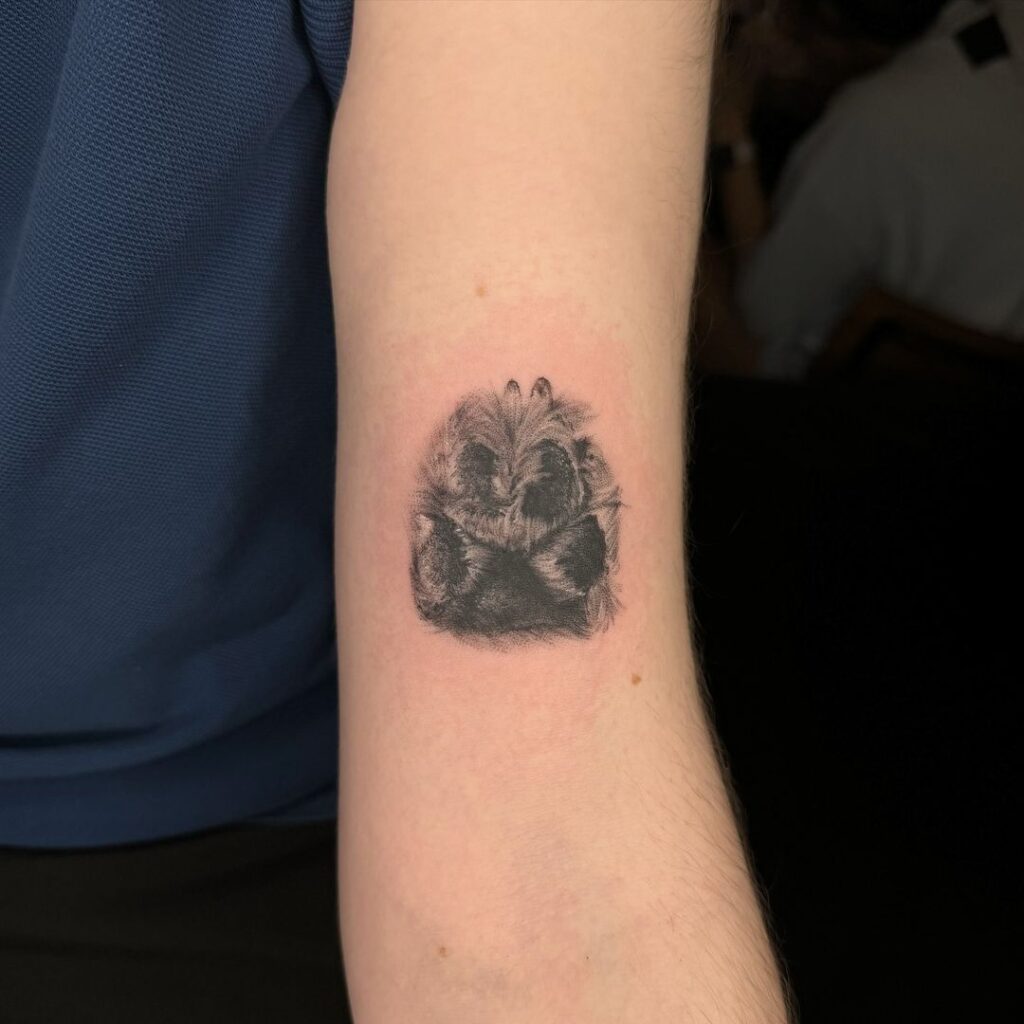 A realistic paw print tattoo 
