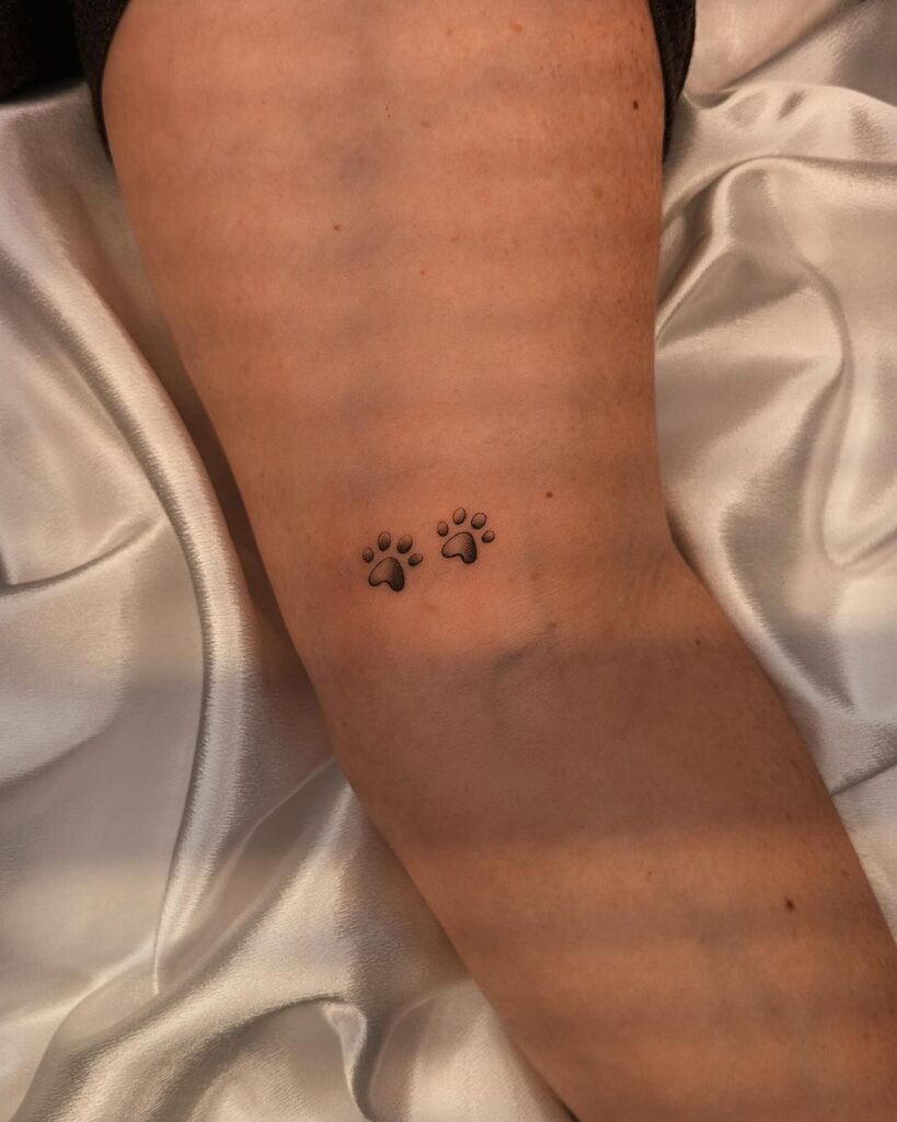 A tiny paw print tattoo