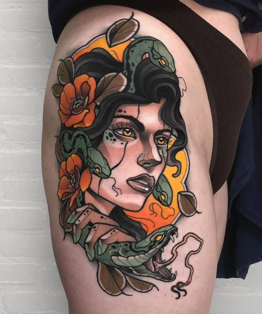 Neo-traditional tattoo depicting a stylized Medusa with vibrant orange flowers and coiling snakes, incorporating bold outlines and rich coloration for a striking and modern take on the classic mythological figure.