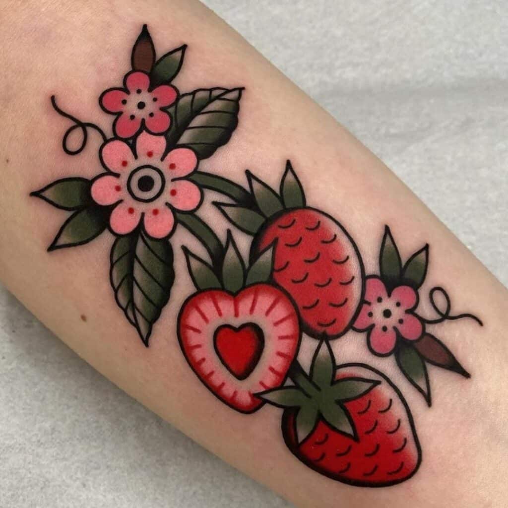Traditional strawberry tattoo on hand